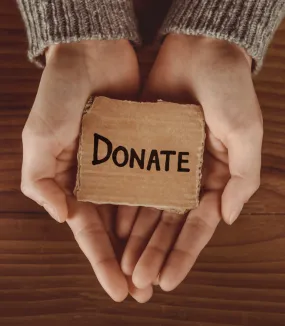 hands with donation written on it